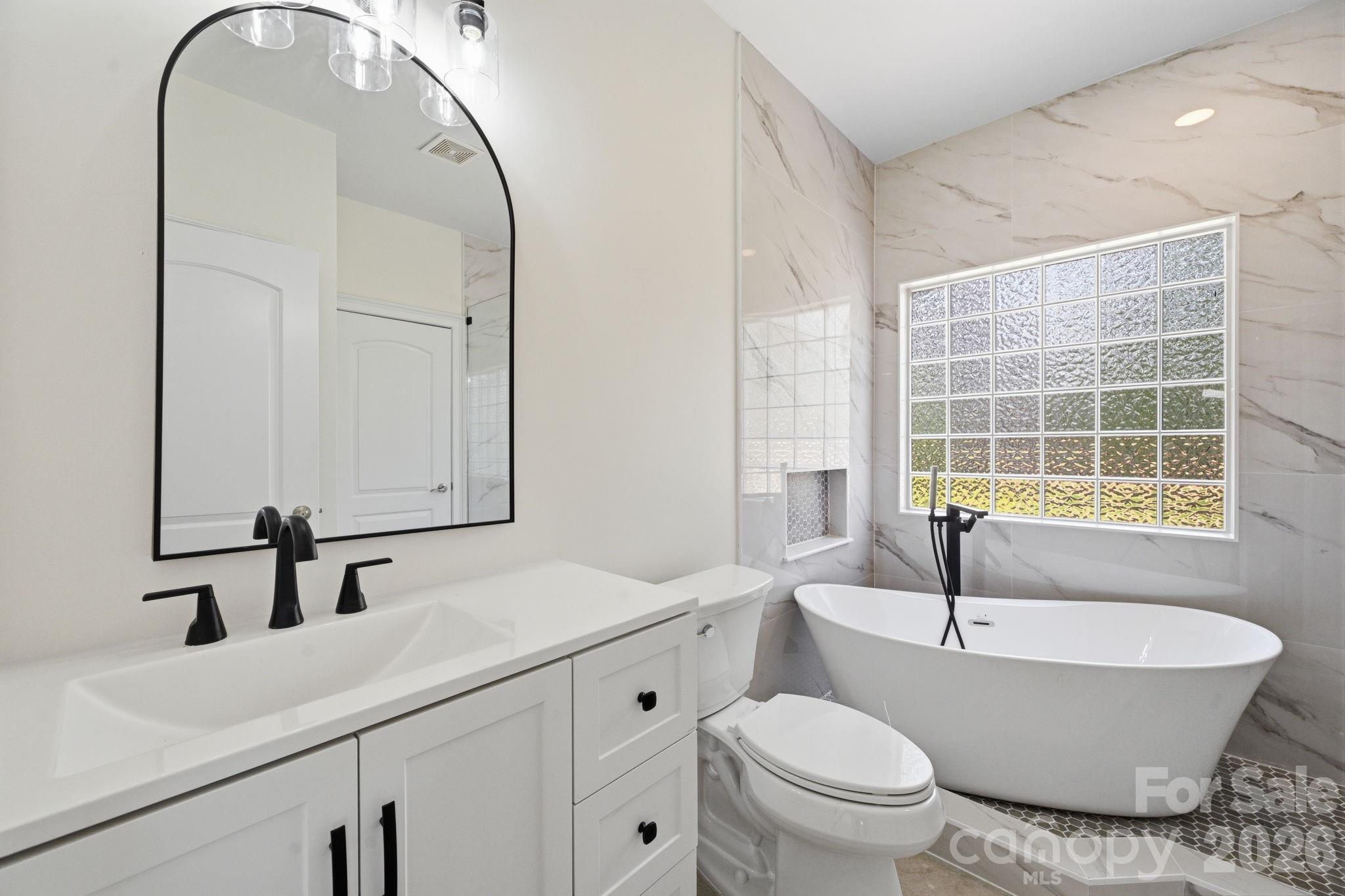 166 Ridge Run Drive Statesville, NC 28625 - Photo 8 of 19 a bathroom with a sink and a mirror