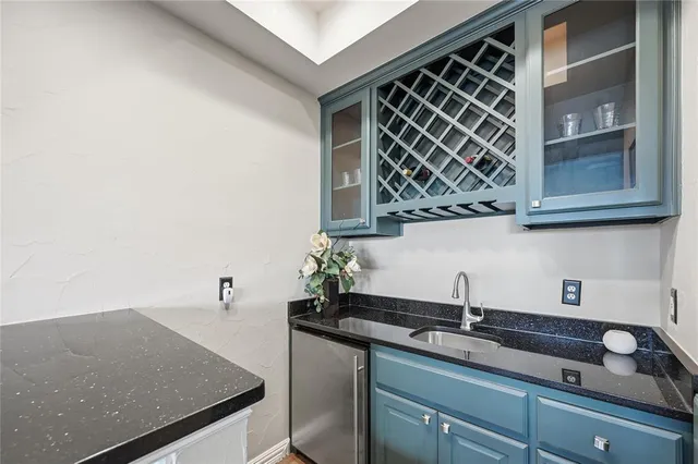 a bedroom with bed and a large window