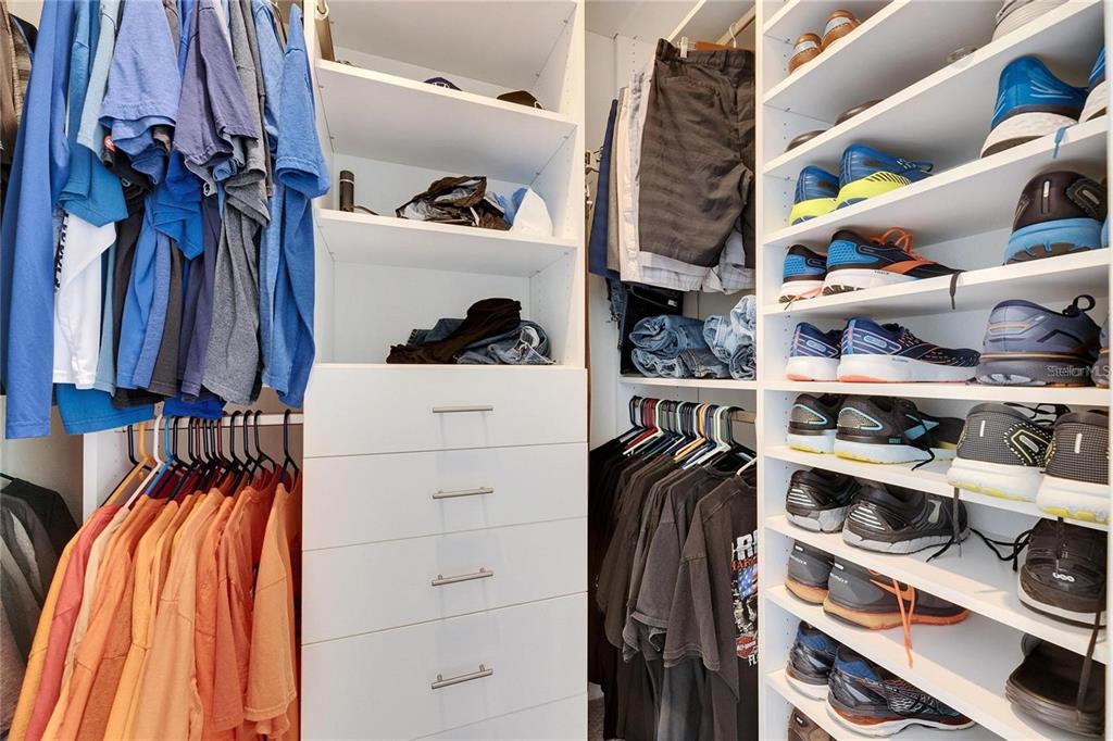 5125 Tannin Lane Lakewood Ranch, FL 34211 - Photo 15 of 45 a view of walk in closet with clothes and shoes