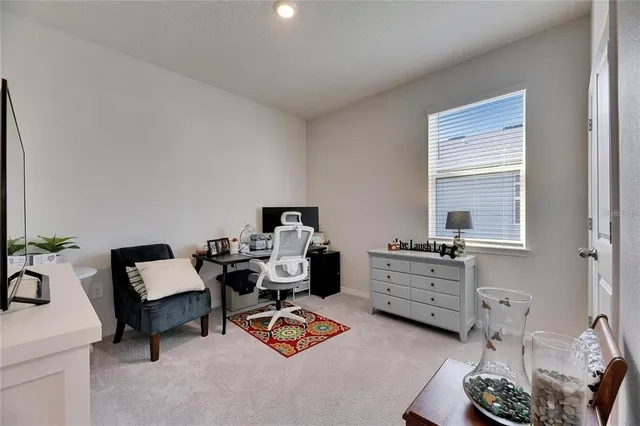 a bedroom with furniture and a window