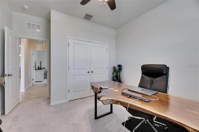 a workspace with furniture and wooden floor
