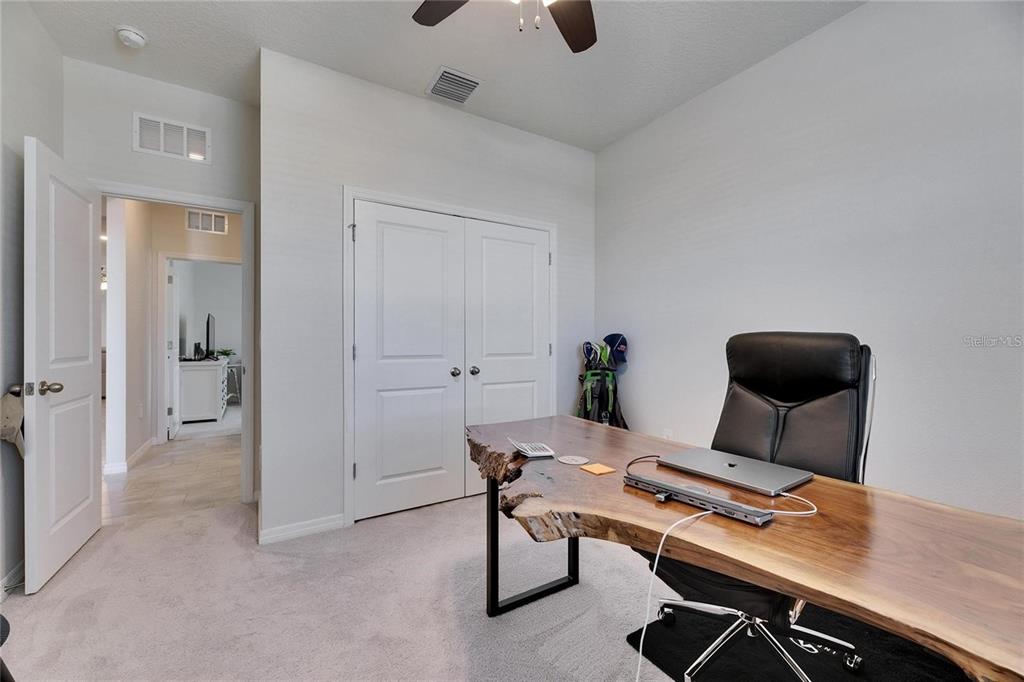 5125 Tannin Lane Lakewood Ranch, FL 34211 - Photo 27 of 45 a workspace with furniture and wooden floor
