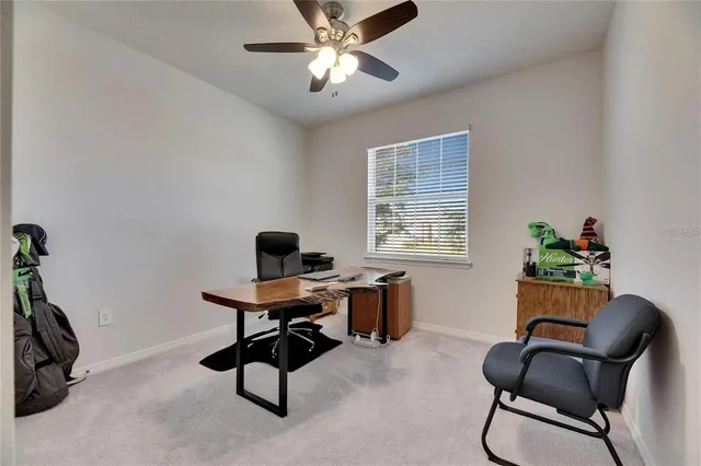 a work room with furniture and windows