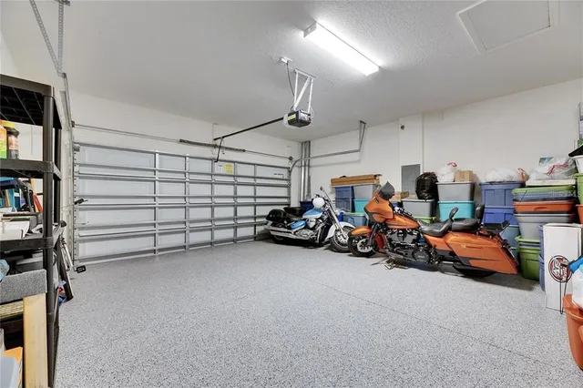 a view of a garage with rack and bicycle