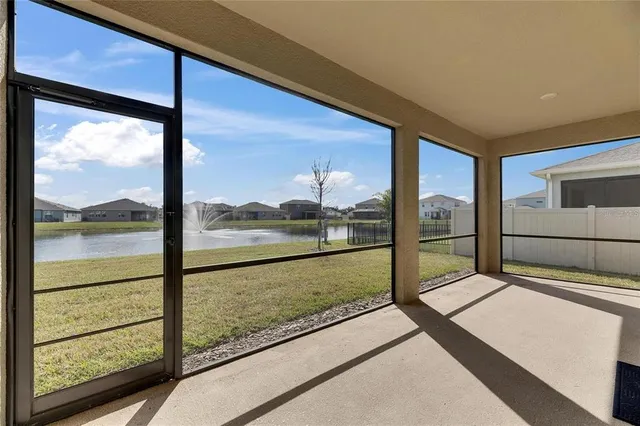 a view of a glass door and the balcony