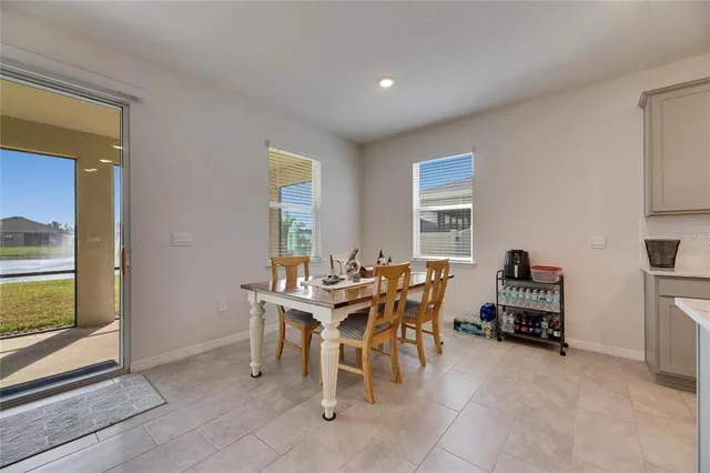 a view of a dining room with furniture window and outside view