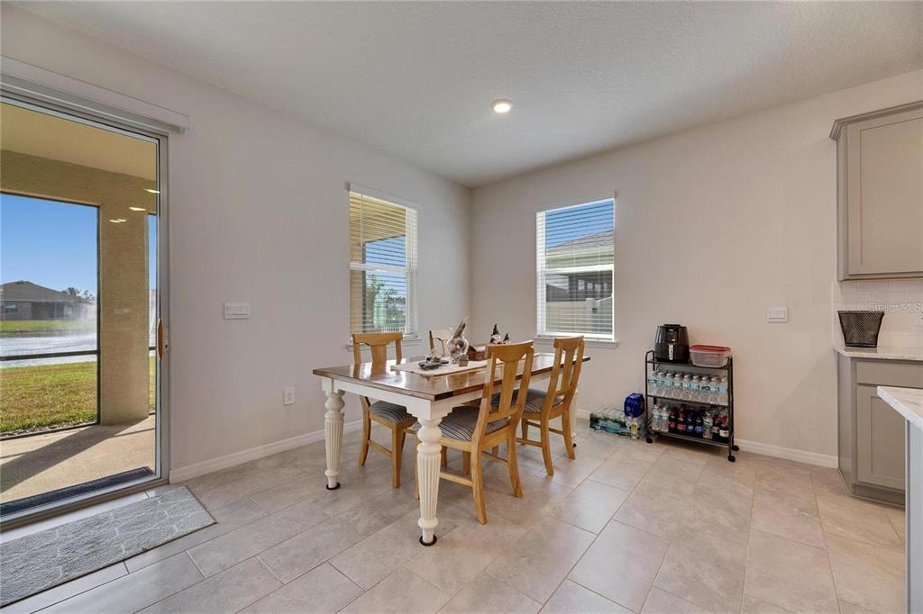 5125 Tannin Lane Lakewood Ranch, FL 34211 - Photo 9 of 45 a view of a dining room with furniture window and outside view