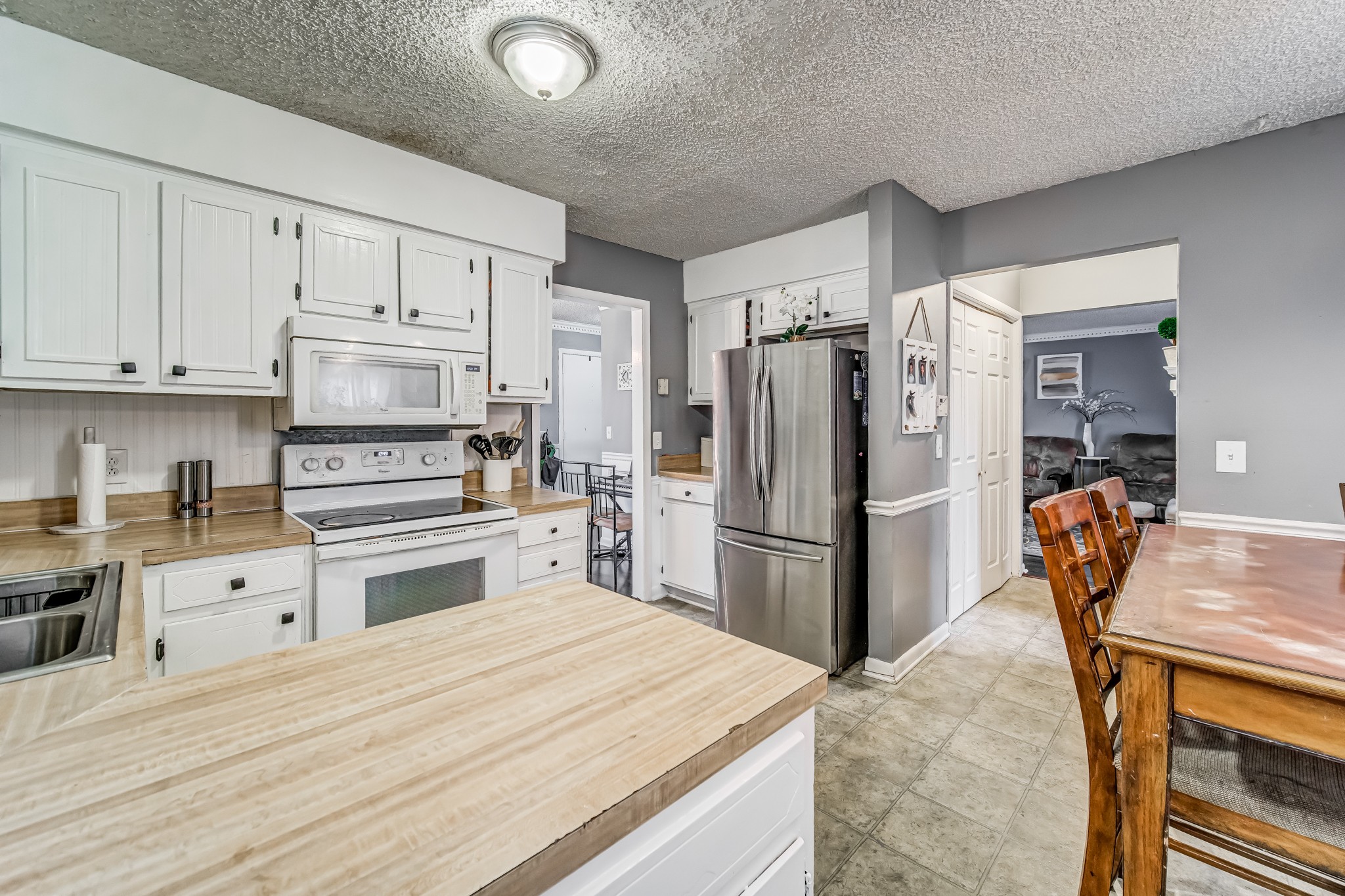 3325 Country Way Road Antioch, TN 37013 - Photo 14 of 37 a kitchen with a refrigerator and a stove top oven