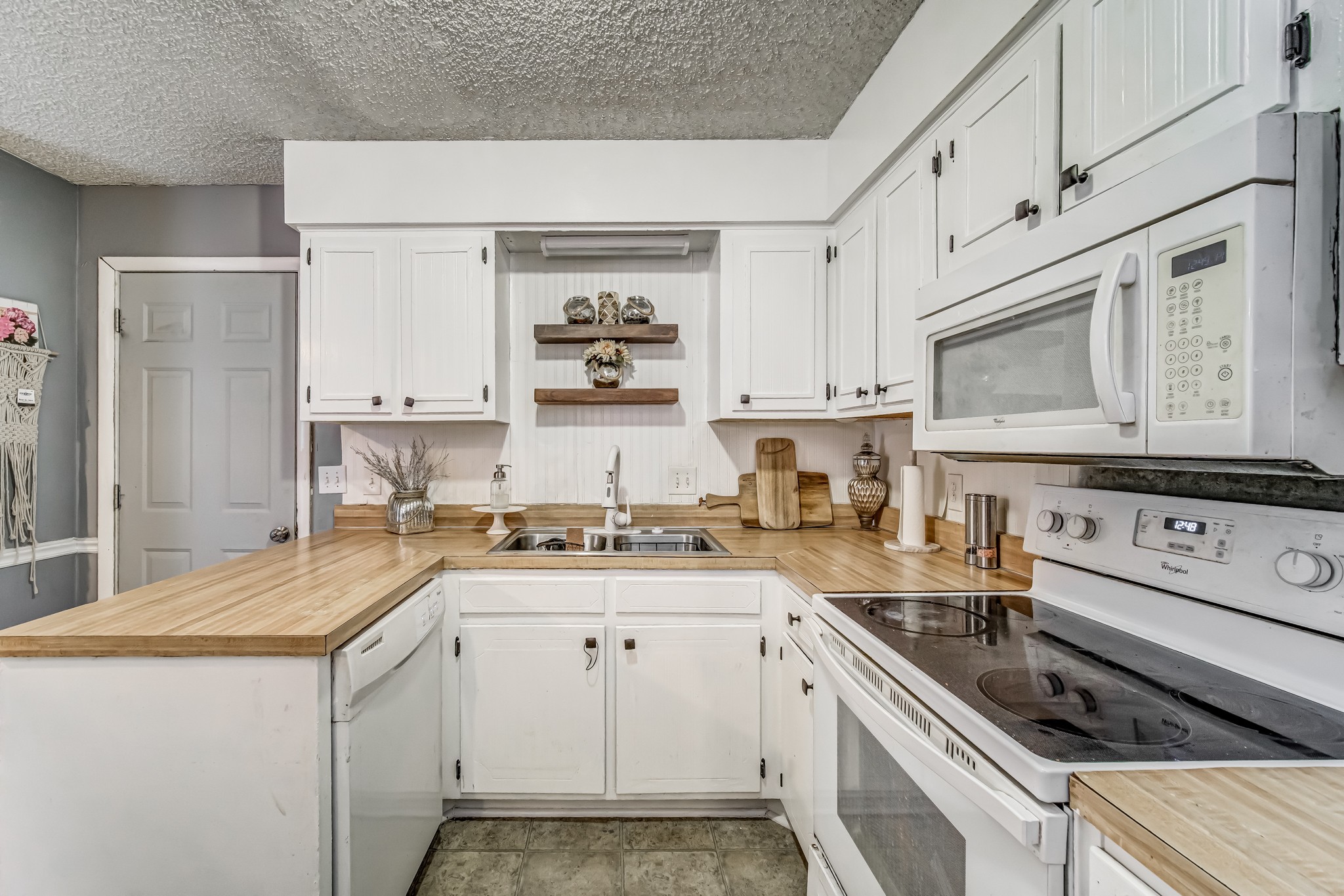 3325 Country Way Road Antioch, TN 37013 - Photo 16 of 37 a kitchen with granite countertop cabinets stainless steel appliances and a sink