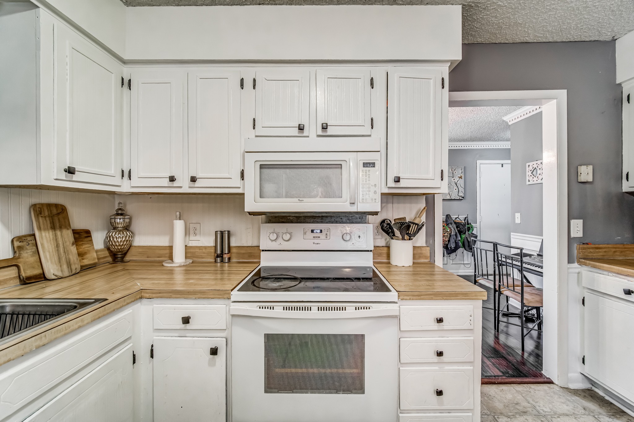 3325 Country Way Road Antioch, TN 37013 - Photo 17 of 37 a kitchen with granite countertop white cabinets and white appliances