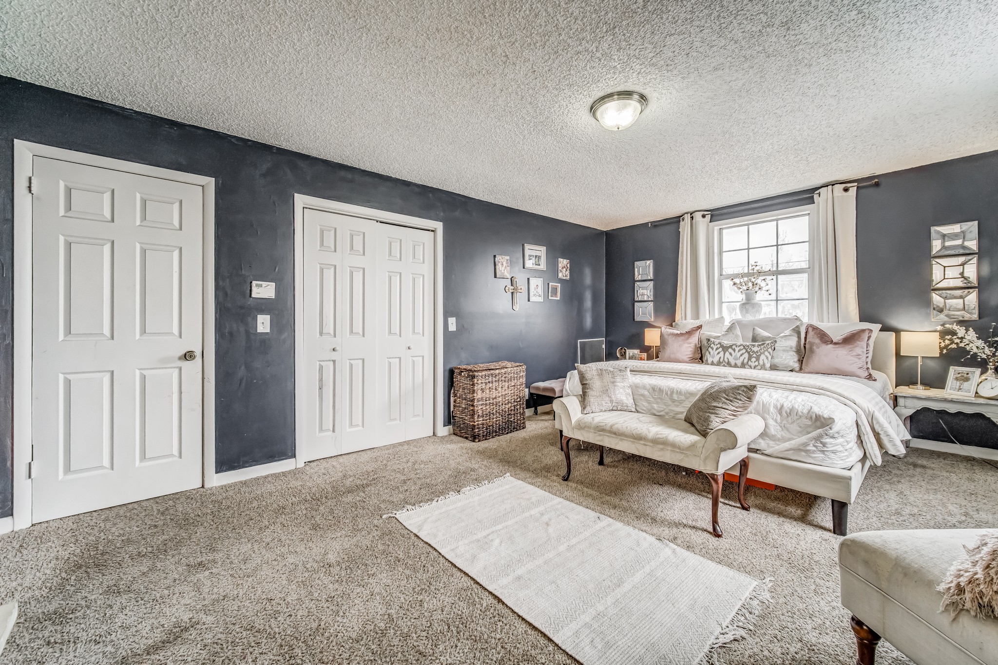 3325 Country Way Road Antioch, TN 37013 - Photo 23 of 37 a spacious bedroom with a bed and glass windows