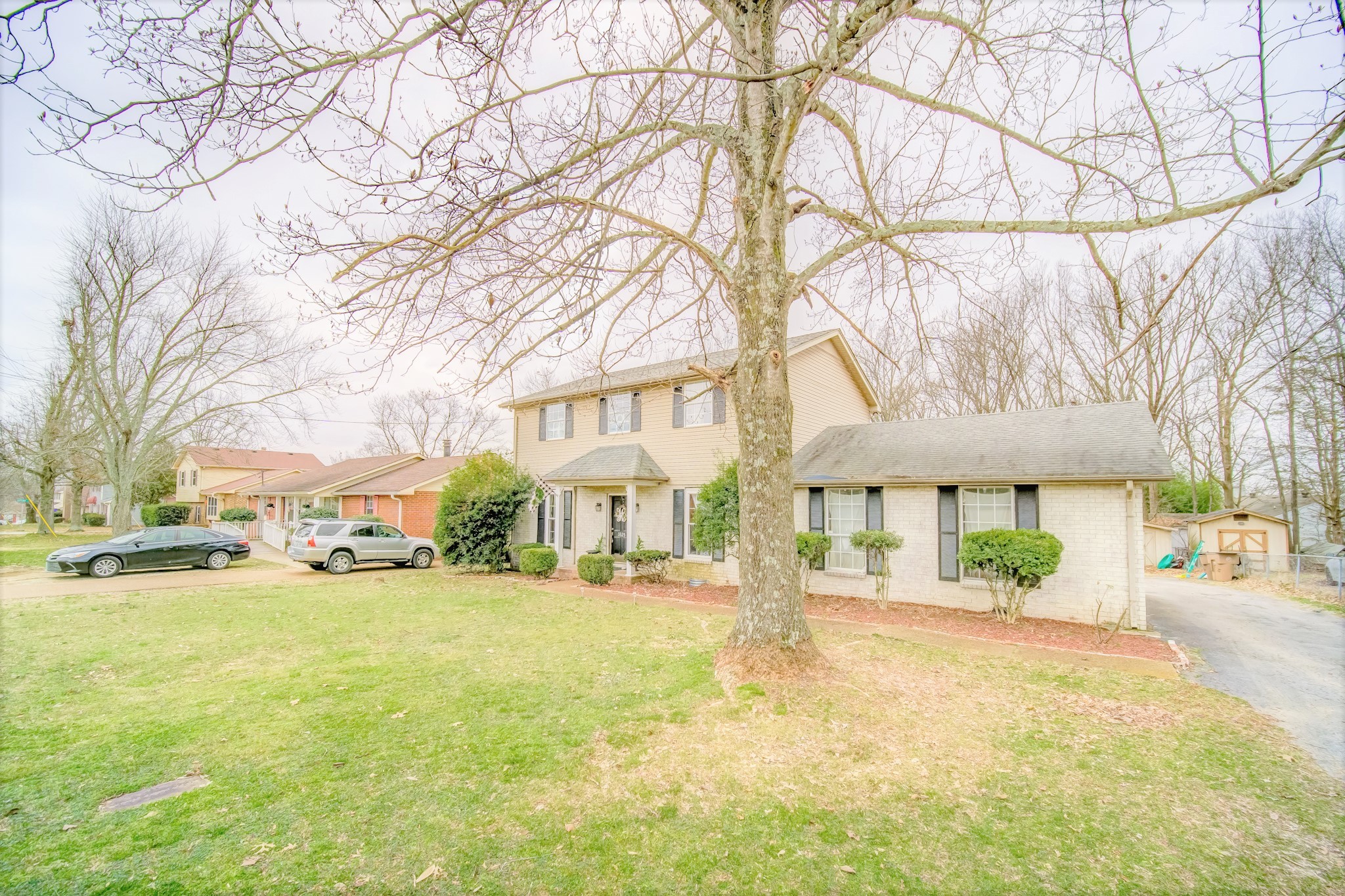 3325 Country Way Road Antioch, TN 37013 - Photo 3 of 37 a view of a white house with a yard and a large tree