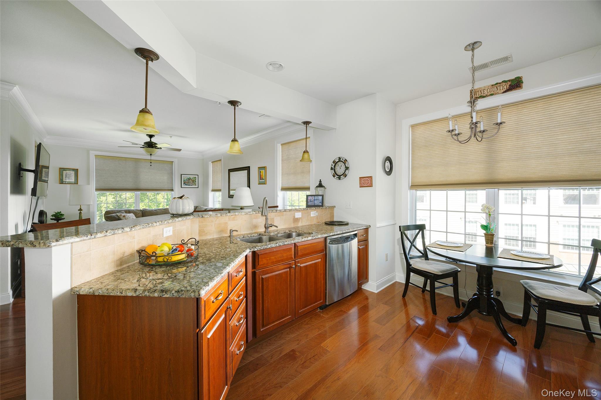 a kitchen with stainless steel appliances granite countertop a stove and refrigerator