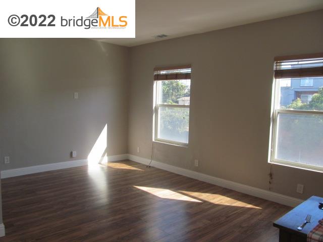 2807 Filbert Street Oakland, CA 94608 - Photo 20 of 29 a view of a room with wooden floor and window