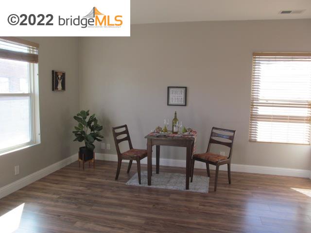 2807 Filbert Street Oakland, CA 94608 - Photo 22 of 29 a view of a livingroom with furniture window and wooden floor