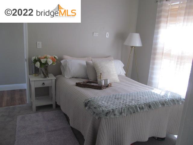 2807 Filbert Street Oakland, CA 94608 - Photo 23 of 29 a bedroom with a bed and a lamp