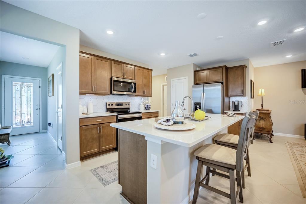 8344 Southwest 54th Loop Ocala, FL 34481 - Photo 5 of 36 a kitchen with appliances cabinets and furniture