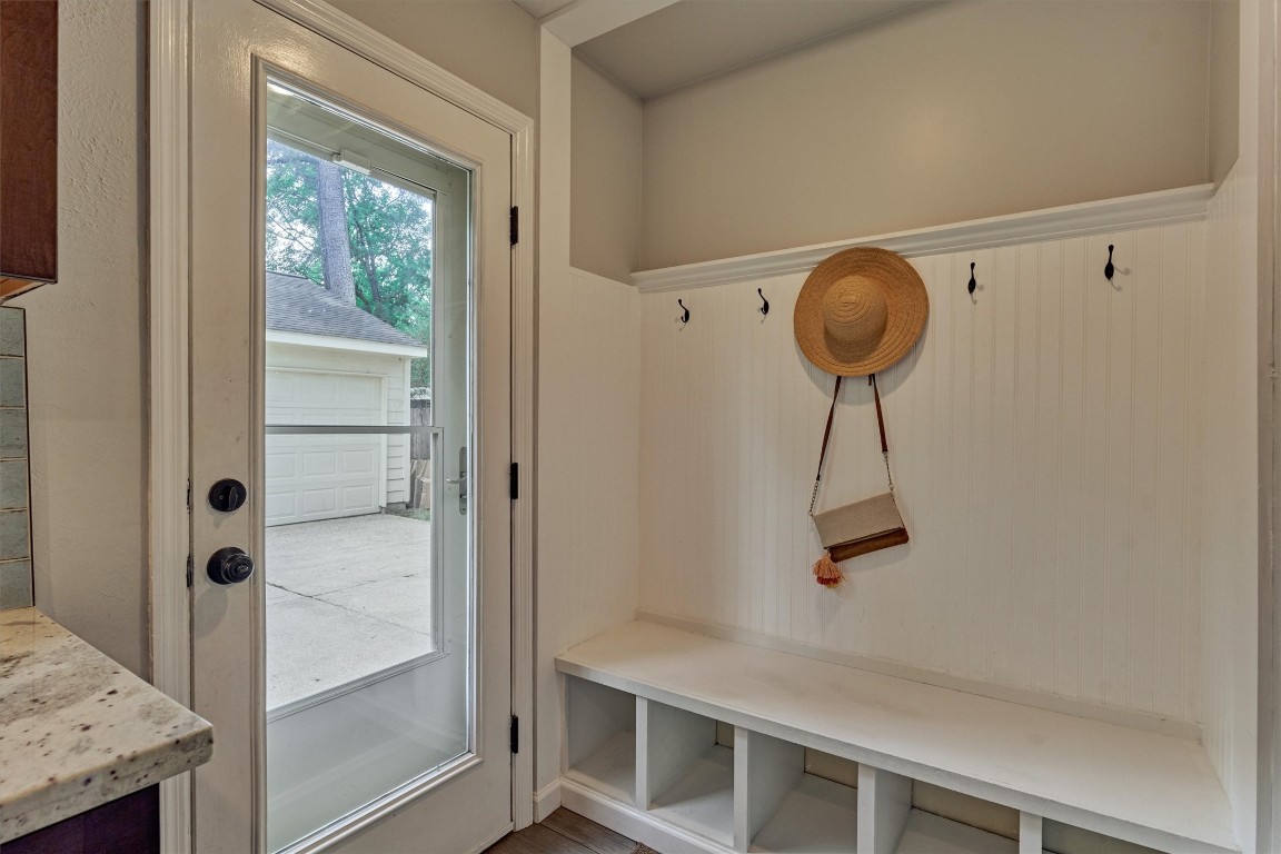 19 Greentwig Place Spring, TX 77381 - Photo 12 of 37 Back door from driveway/garage area. Excellent drop-space for all the family's needs.
