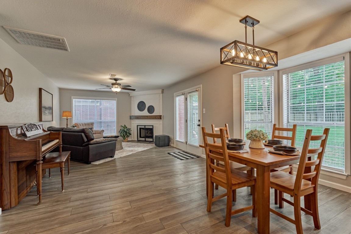 19 Greentwig Place Spring, TX 77381 - Photo 15 of 37 Large space for family to gather. Wall of windows with view to back yard.