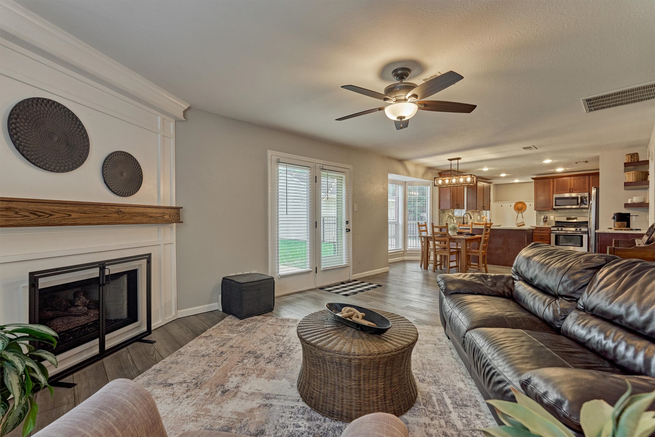 19 Greentwig Place Spring, TX 77381 - Photo 17 of 37 a living room with furniture and a fireplace