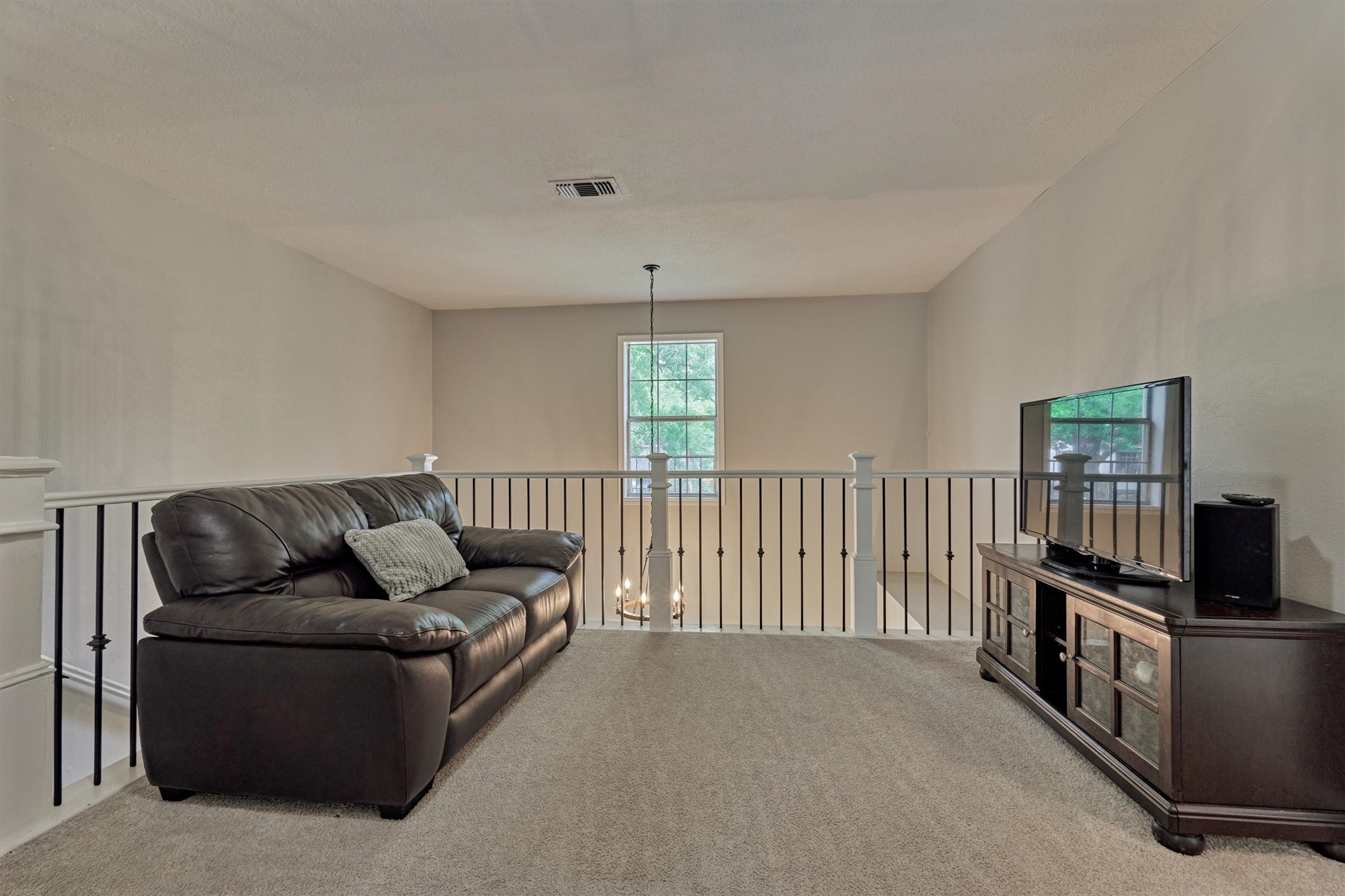 19 Greentwig Place Spring, TX 77381 - Photo 19 of 37 a living room with furniture tv and a window