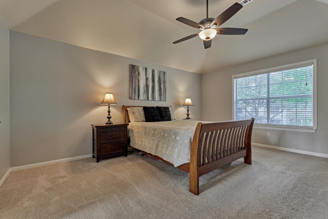 19 Greentwig Place Spring, TX 77381 - Photo 20 of 37 Primary suite. Large bedroom with front facing windows. High ceiling.