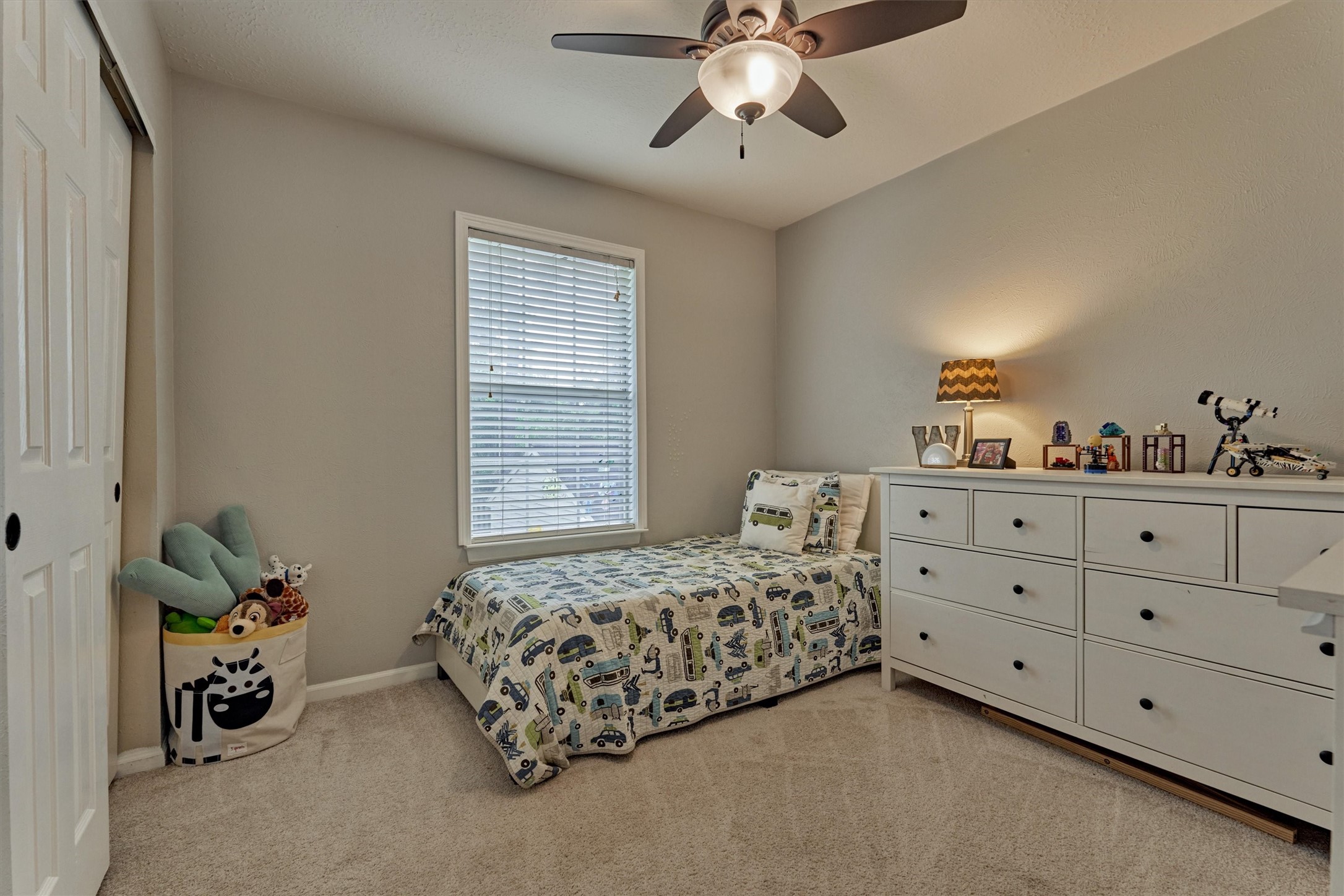19 Greentwig Place Spring, TX 77381 - Photo 25 of 37 a bedroom with a bed and a dresser