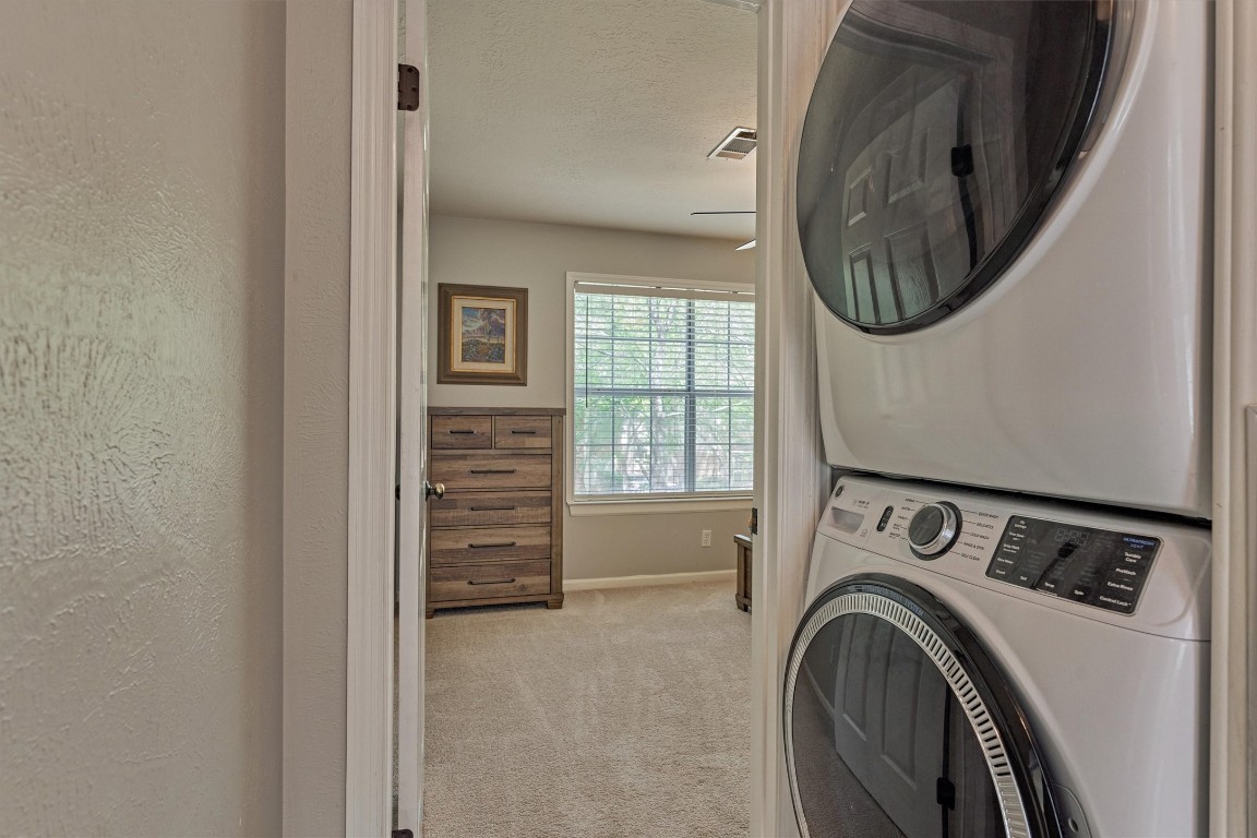 19 Greentwig Place Spring, TX 77381 - Photo 28 of 37 Stacked Washer/Dryer conveys with home. Conveniently located near all bedrooms.