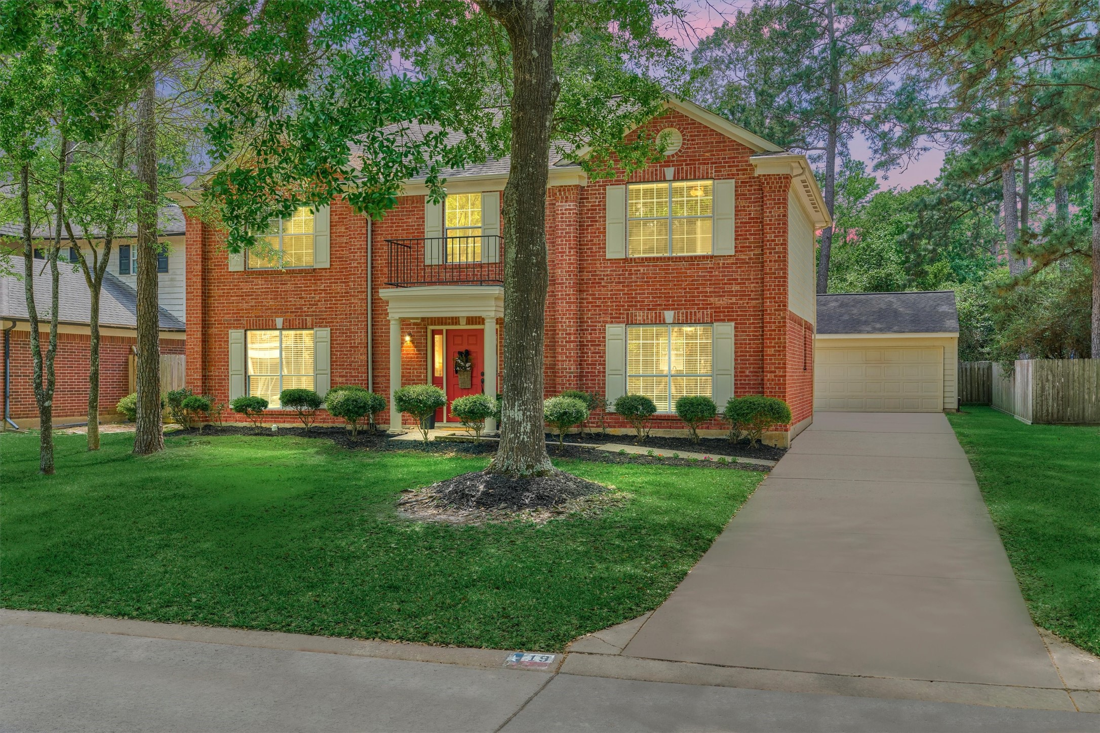 19 Greentwig Place Spring, TX 77381 - Photo 30 of 37 a front view of a house with a yard and trees