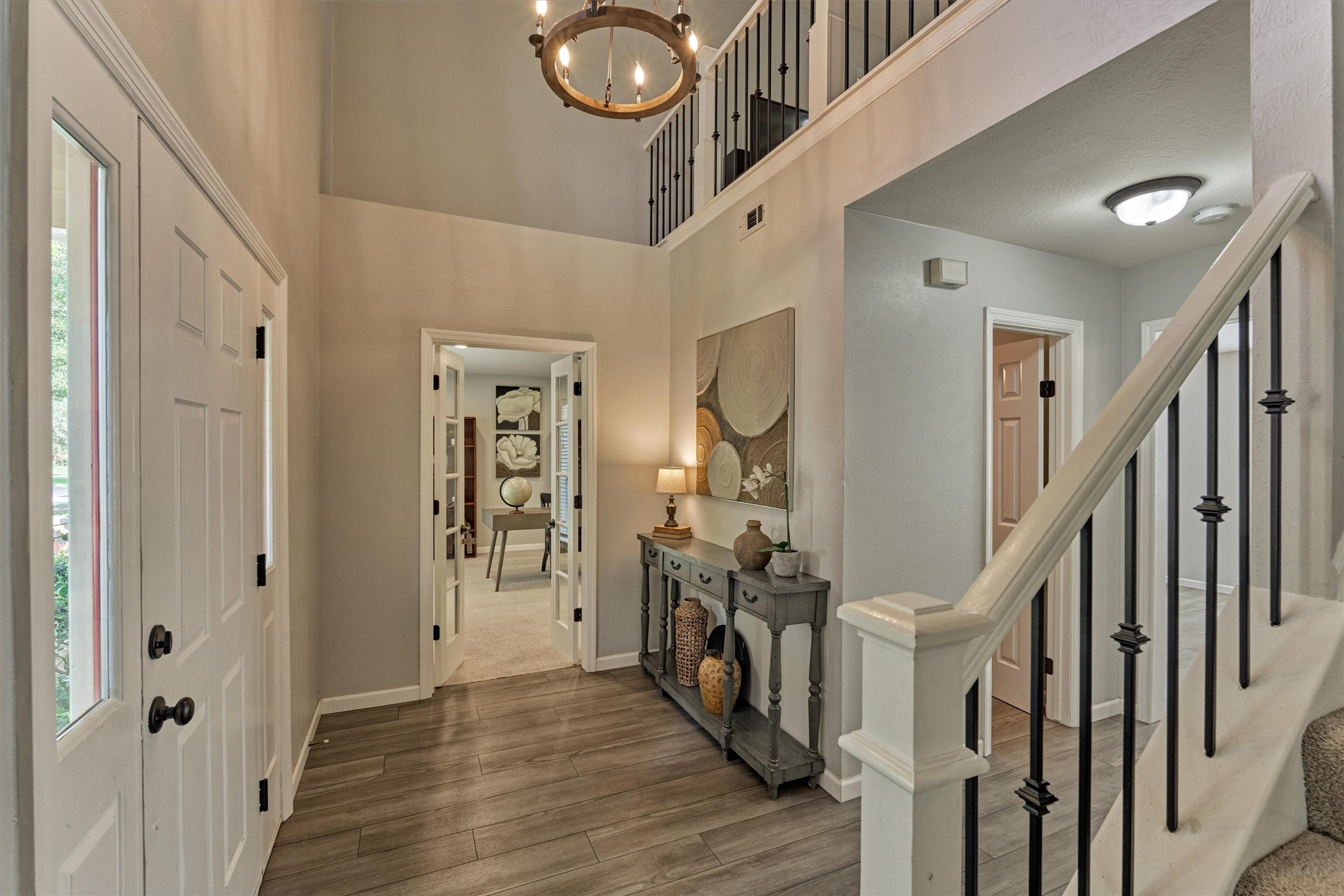19 Greentwig Place Spring, TX 77381 - Photo 4 of 37 Front door on left with view into home office/study with glass French doors.
