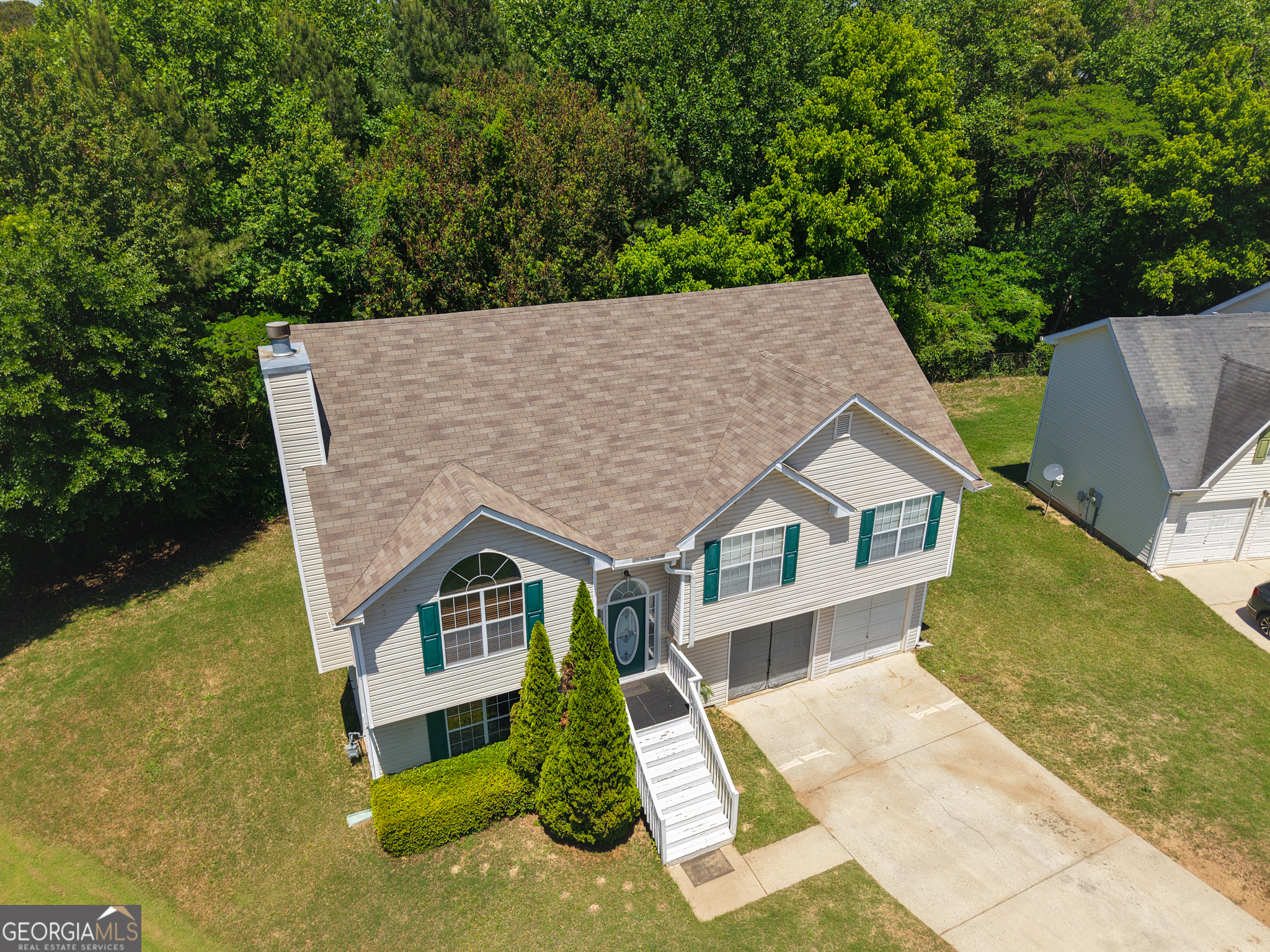 11036 Pebble Ridge Drive Hampton, GA 30228 - Photo 3 of 35 a house view with a garden space