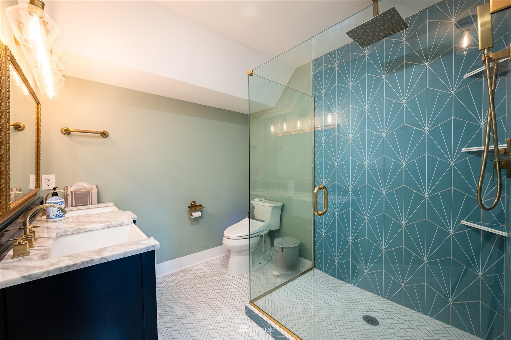 3373 Hillside Road Deming, WA 98244 - Photo 21 of 40 a bathroom with a sink a toilet and shower