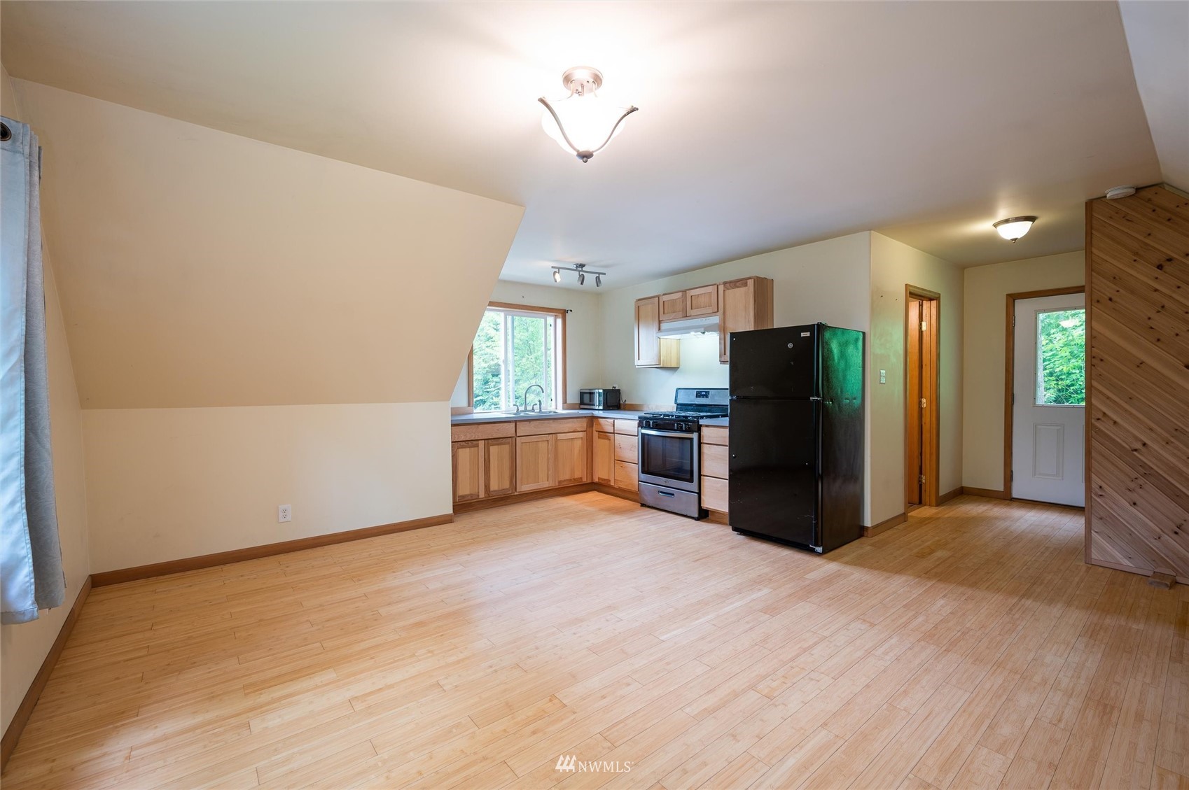 3373 Hillside Road Deming, WA 98244 - Photo 25 of 40 a view of a kitchen with furniture and a refrigerator