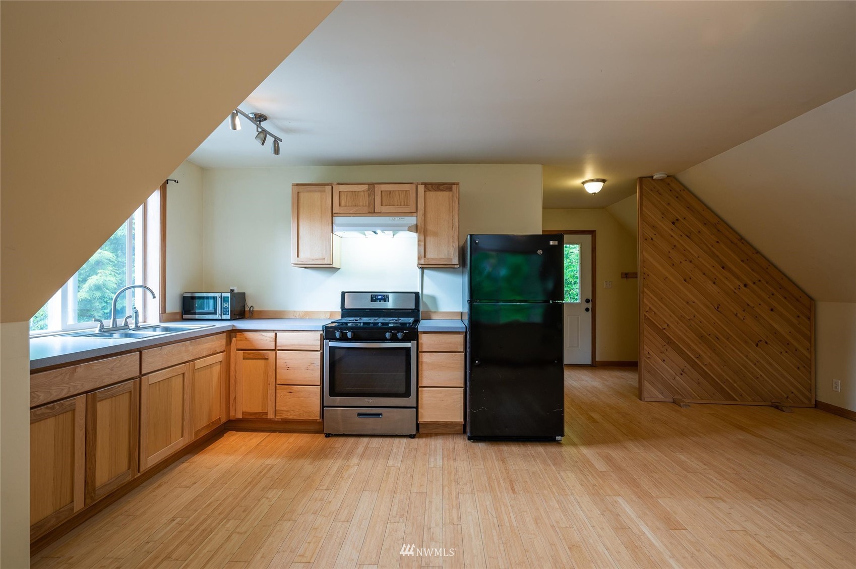 3373 Hillside Road Deming, WA 98244 - Photo 26 of 40 a large kitchen with stainless steel appliances granite countertop a refrigerator and a stove top oven