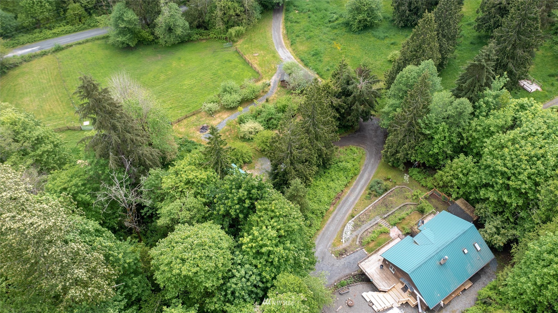 3373 Hillside Road Deming, WA 98244 - Photo 4 of 40 an aerial view of a house with a yard and lake view