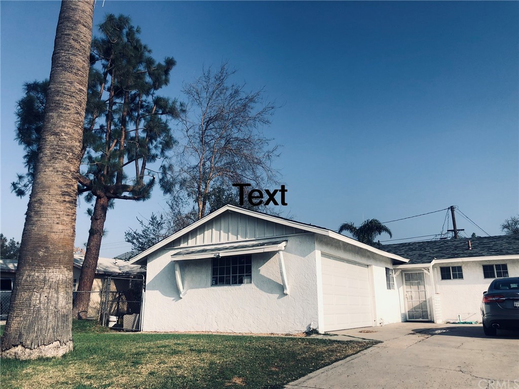 6357 Cinnabar Drive Riverside, CA 92509 - Photo 1 of 1 a front view of a house with garden