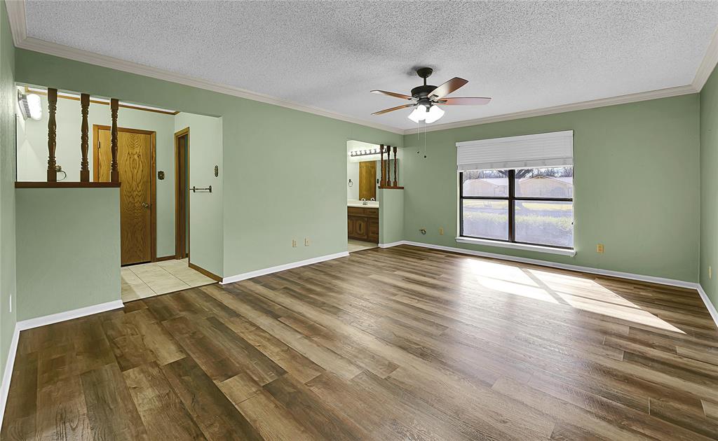 210 Chelsea Drive Hewitt, TX 76643 - Photo 14 of 36 a view of empty room with wooden floor and fan