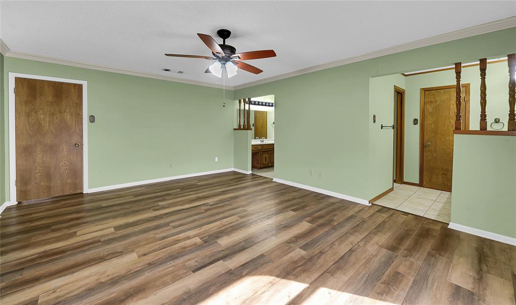 210 Chelsea Drive Hewitt, TX 76643 - Photo 16 of 36 a view of empty room with wooden floor and fan