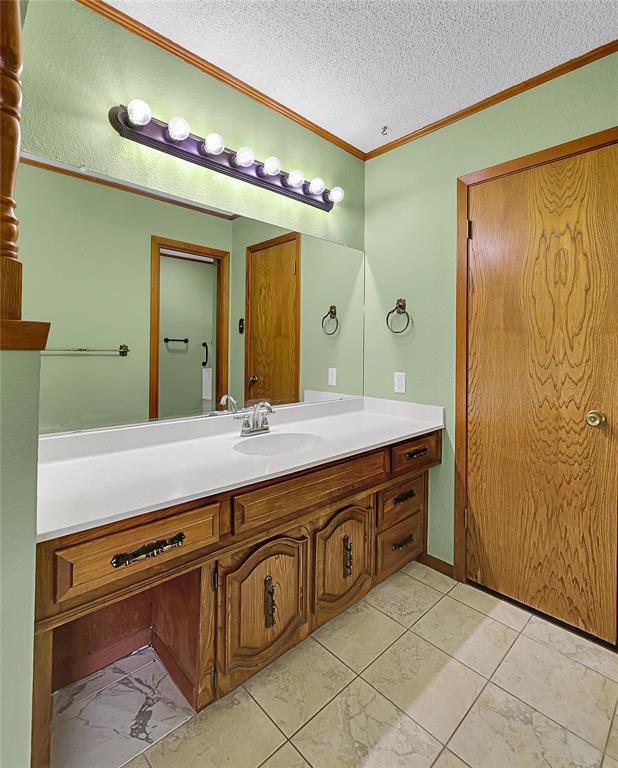 210 Chelsea Drive Hewitt, TX 76643 - Photo 17 of 36 a spacious bathroom with a granite countertop sink mirror and shower