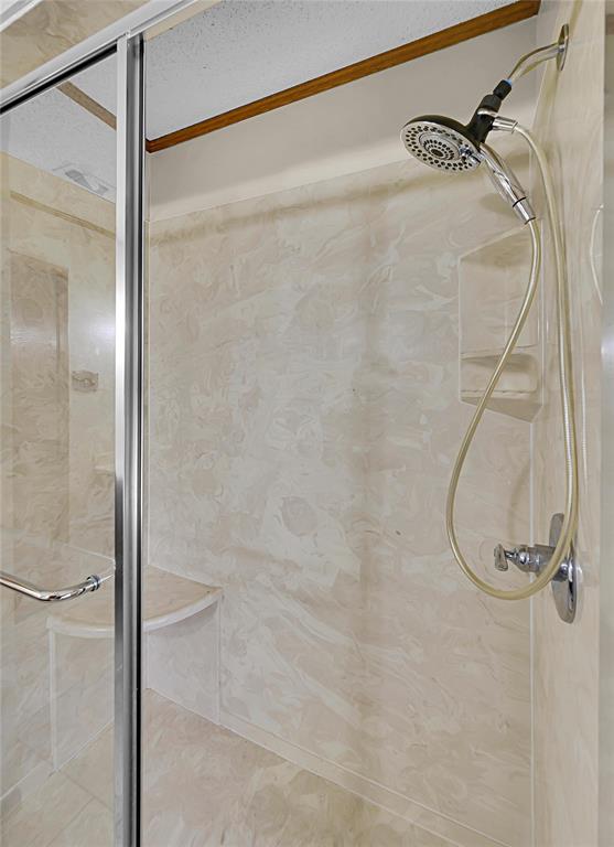 210 Chelsea Drive Hewitt, TX 76643 - Photo 25 of 36 a bathroom with a glass shower door