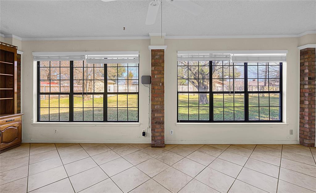 210 Chelsea Drive Hewitt, TX 76643 - Photo 28 of 36 a view of an empty room with window and cabinet area