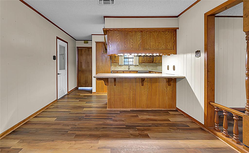 210 Chelsea Drive Hewitt, TX 76643 - Photo 8 of 36 a view of kitchen with wooden floor