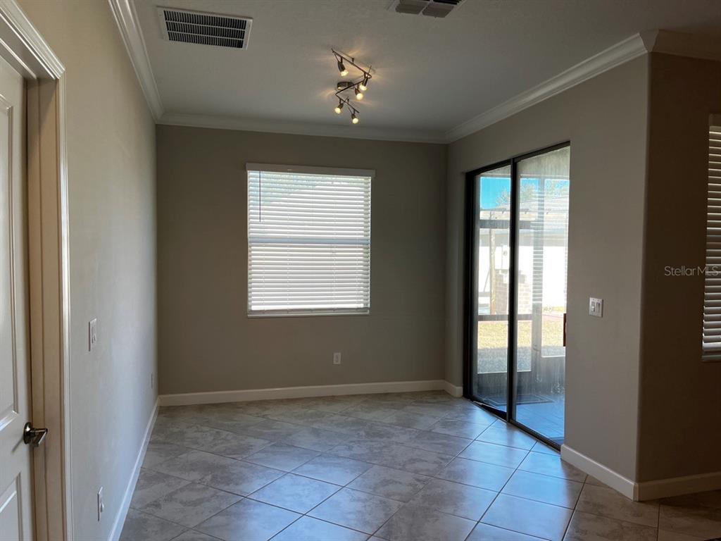 25195 Lambrusco Loop Lutz, FL 33559 - Photo 15 of 36 an empty room with windows and closet