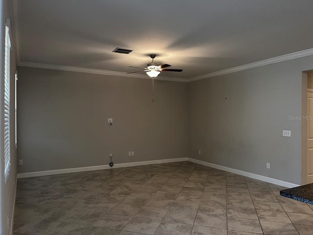 25195 Lambrusco Loop Lutz, FL 33559 - Photo 17 of 36 a view of a chandelier fan in big room