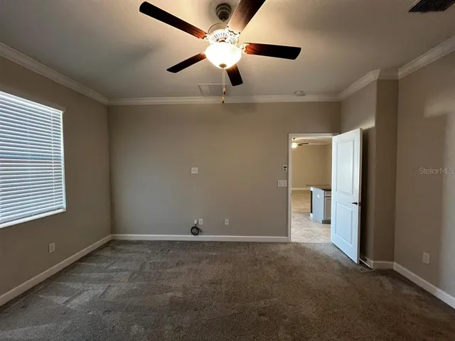 a view of an empty room with a window
