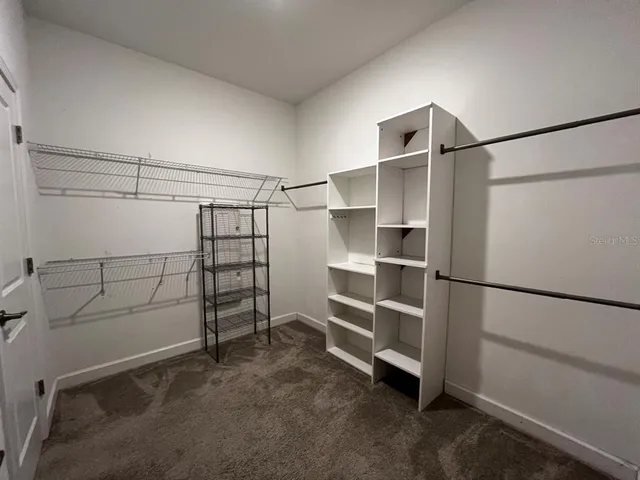 a view of an empty walk in closet