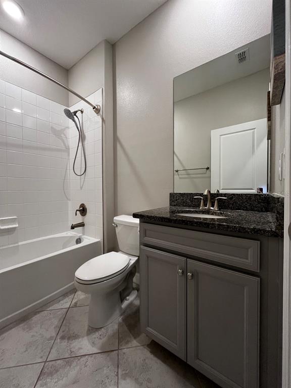 25195 Lambrusco Loop Lutz, FL 33559 - Photo 27 of 36 a bathroom with a granite countertop toilet sink and mirror