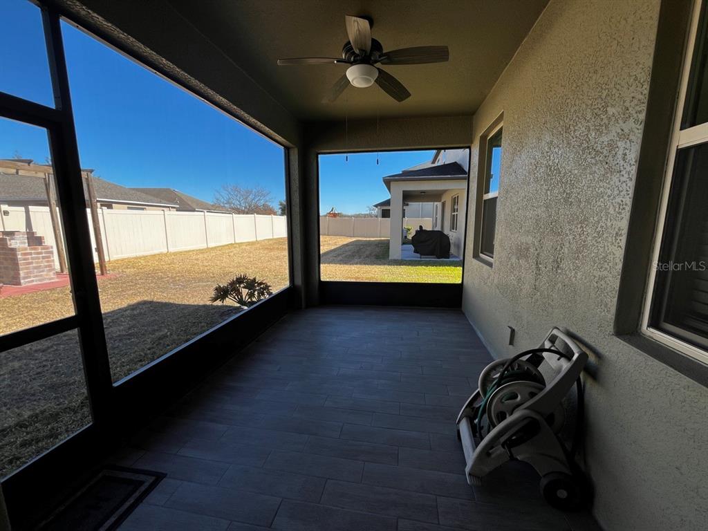 25195 Lambrusco Loop Lutz, FL 33559 - Photo 31 of 36 a view of a room with wooden floor and windows