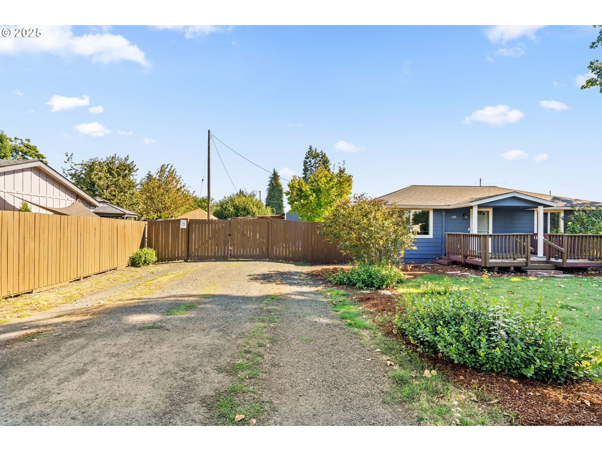 1191 30th Street Springfield, OR 97478 - Photo 3 of 35 a view of a house with backyard and sitting area