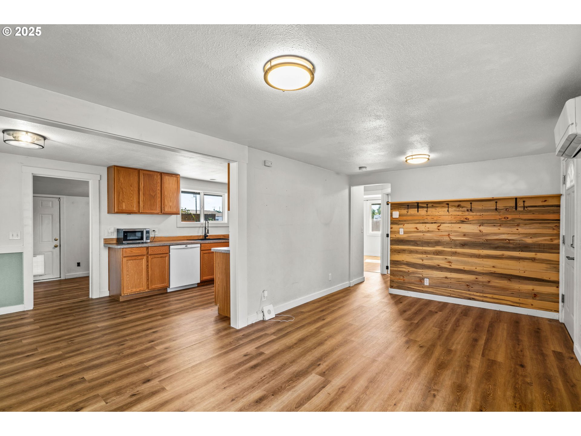 1191 30th Street Springfield, OR 97478 - Photo 8 of 35 a view of kitchen with stainless steel appliances cabinets and wooden floor